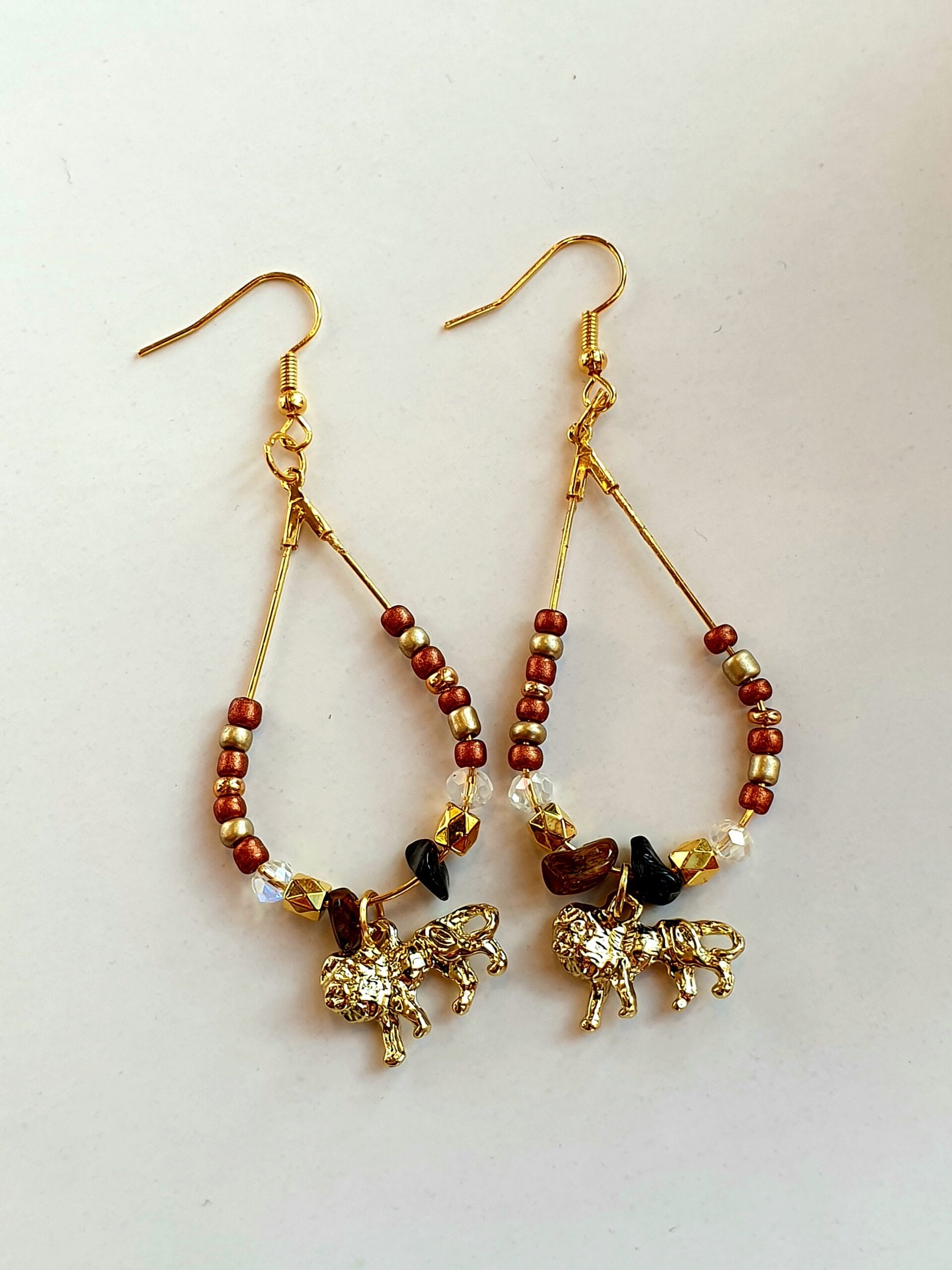 Oorbellen goudkleurig ovaal/ bruin, goudkleurig, leeuw